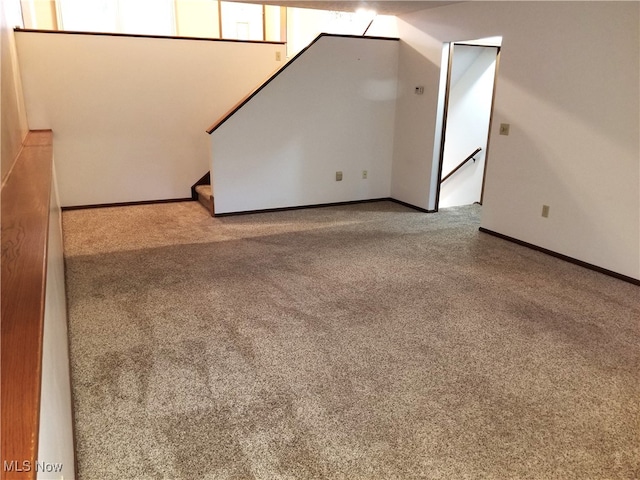 empty room with light colored carpet and plenty of natural light