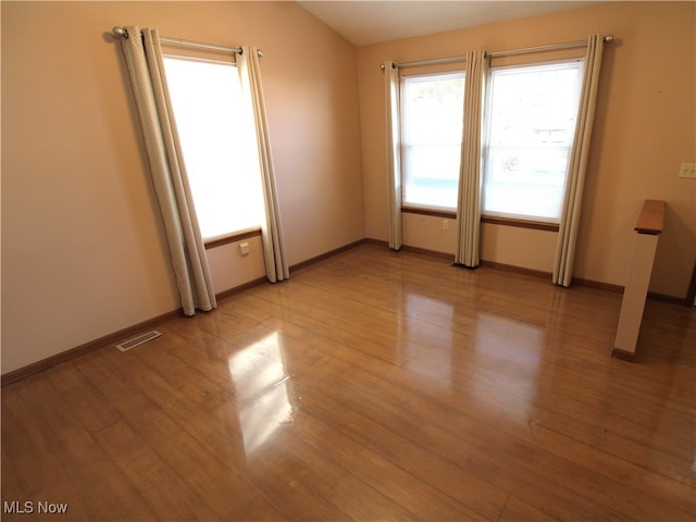 spare room with light hardwood / wood-style floors