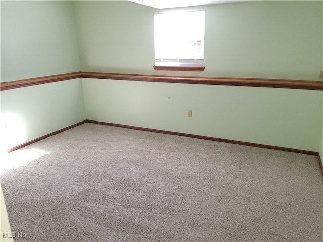 spare room featuring carpet flooring