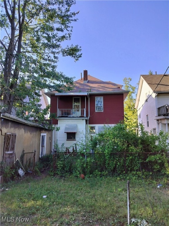 view of front of home with a balcony