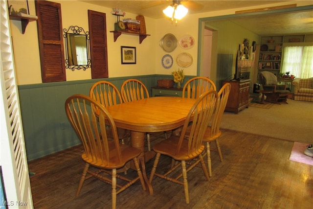 dining space featuring ceiling fan and wood-type flooring