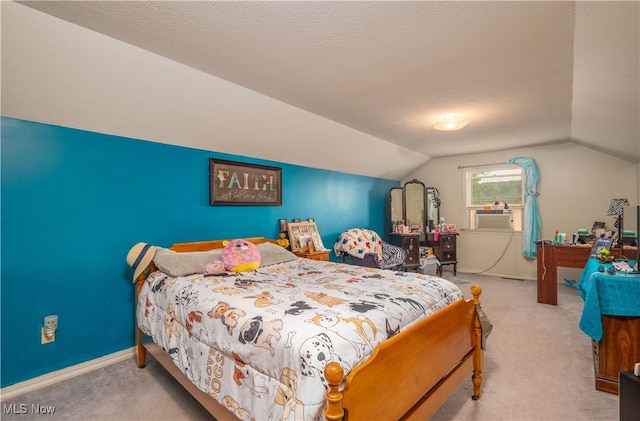 bedroom featuring a textured ceiling, vaulted ceiling, cooling unit, and light colored carpet