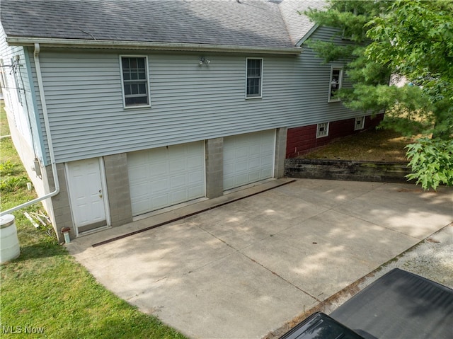 exterior space with a garage