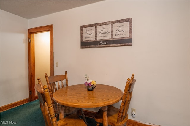 dining room featuring carpet flooring