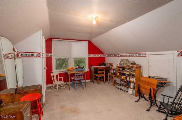 game room featuring vaulted ceiling, light colored carpet, and a textured ceiling