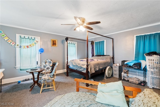 bedroom featuring ceiling fan, carpet floors, crown molding, and a textured ceiling