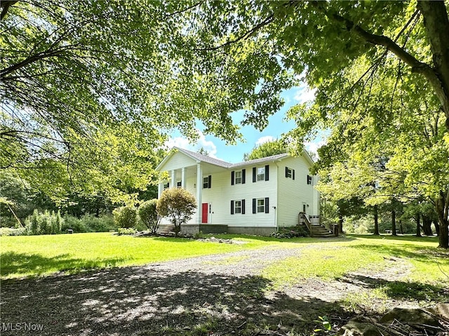 back of house featuring a yard