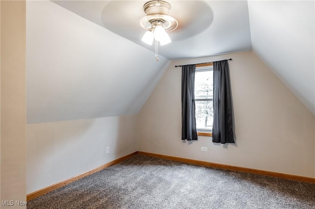 bonus room with baseboards, vaulted ceiling, a ceiling fan, and carpet flooring