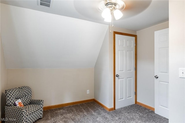 additional living space featuring baseboards, visible vents, vaulted ceiling, and carpet flooring