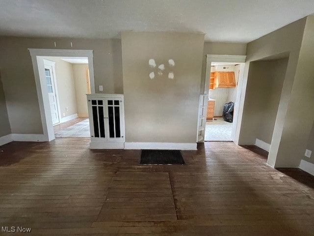 unfurnished room with hardwood / wood-style floors