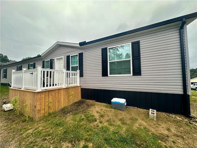 view of property exterior with a yard