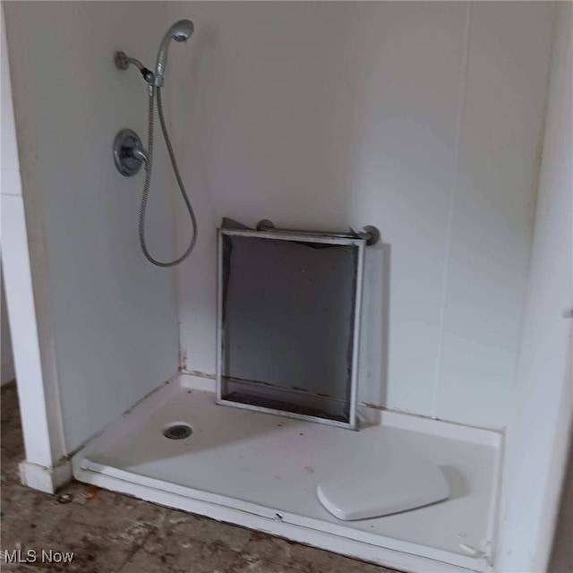 bathroom with walk in shower and tile patterned floors