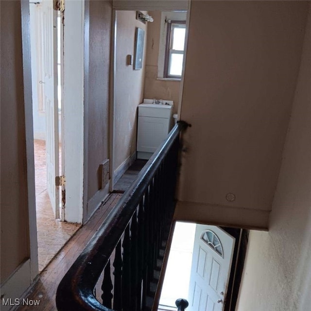 stairway with washer / clothes dryer