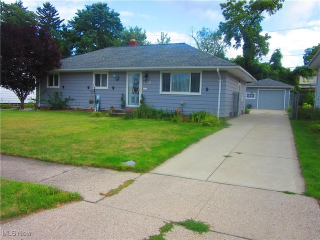 ranch-style home with an outbuilding, roof with shingles, a garage, driveway, and a front lawn