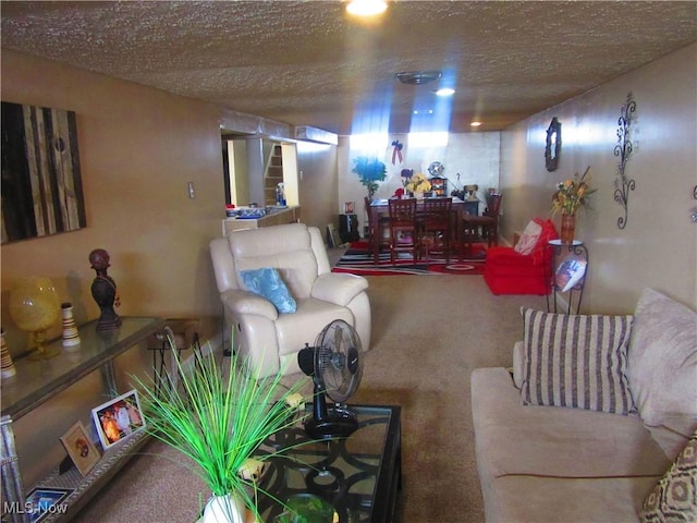 living room featuring a textured ceiling and carpet floors