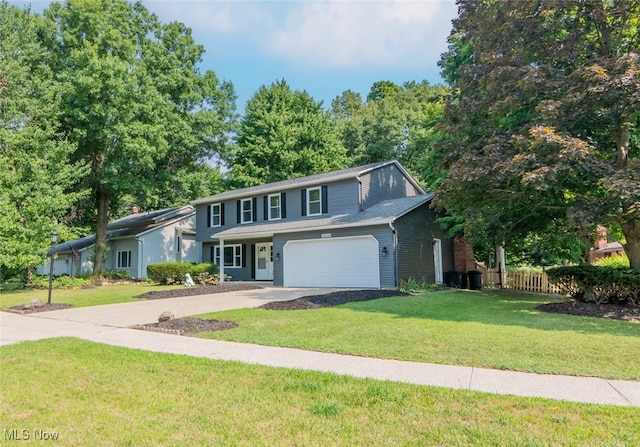 view of front property with a front lawn and a garage