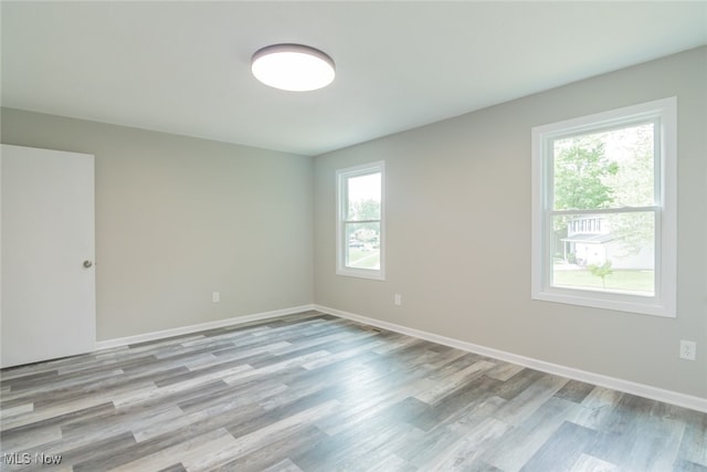 spare room featuring hardwood / wood-style floors