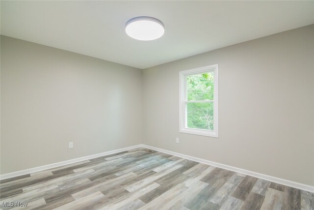 spare room featuring hardwood / wood-style flooring