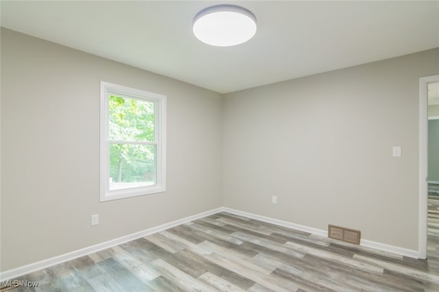 unfurnished room featuring wood-type flooring