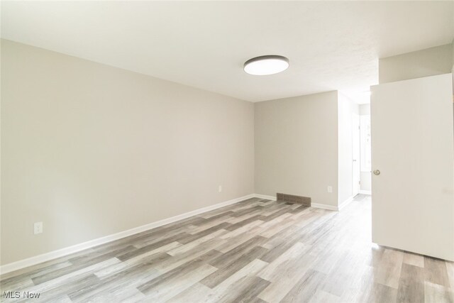 empty room with light wood-type flooring