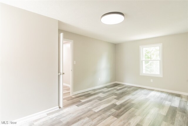 empty room with light wood-type flooring