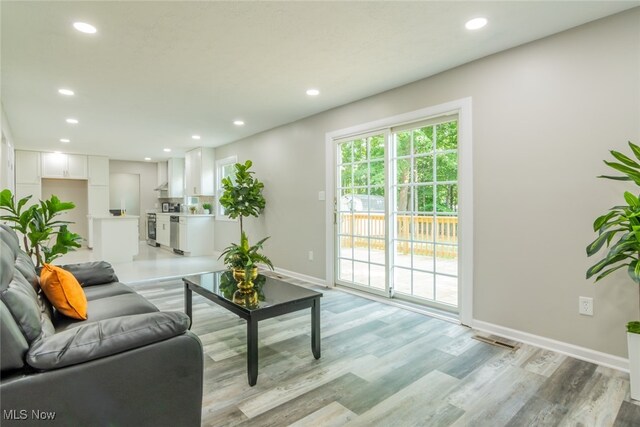 living room with light hardwood / wood-style floors