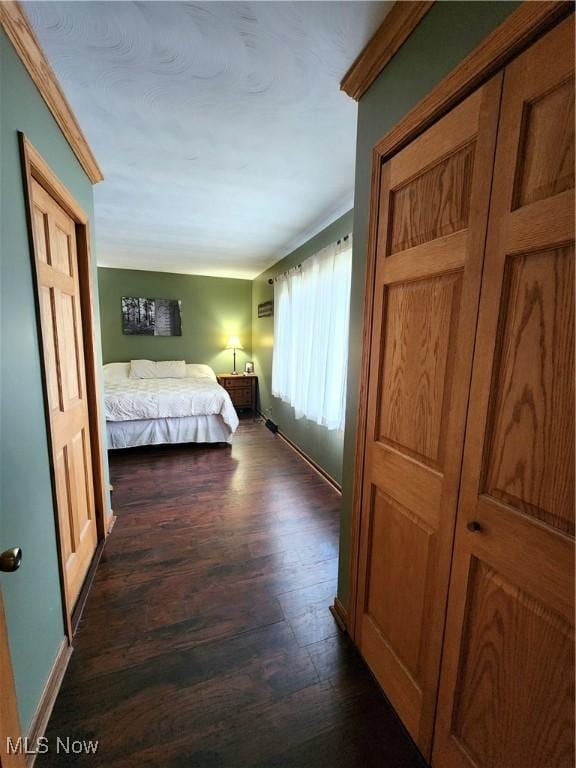 bedroom featuring dark hardwood / wood-style flooring