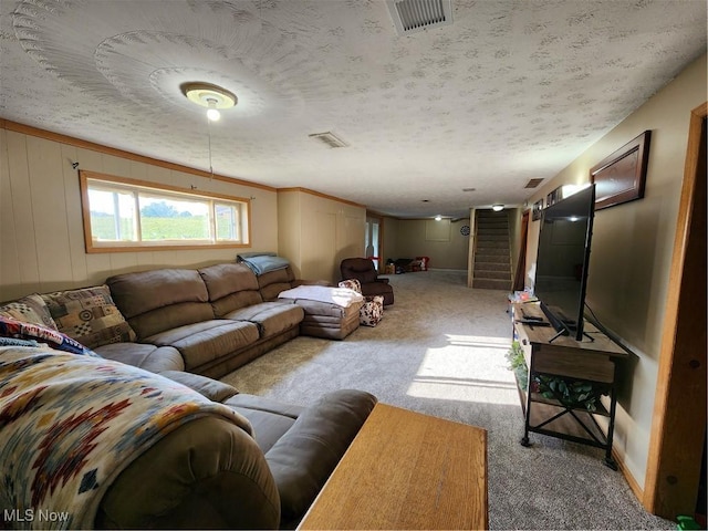 living room with light colored carpet and a textured ceiling