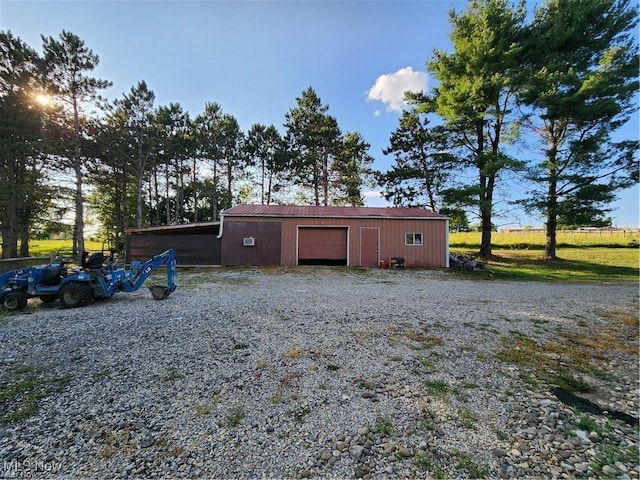 view of outbuilding featuring a garage