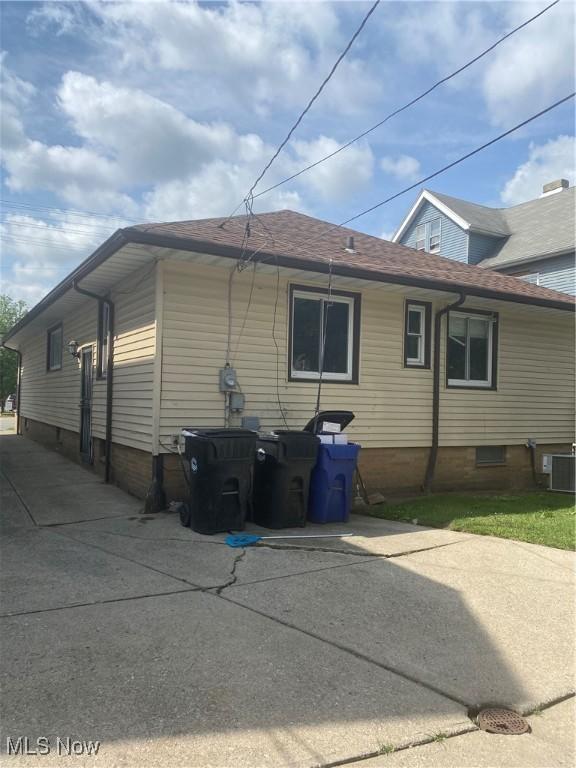 view of home's exterior featuring a patio area and cooling unit