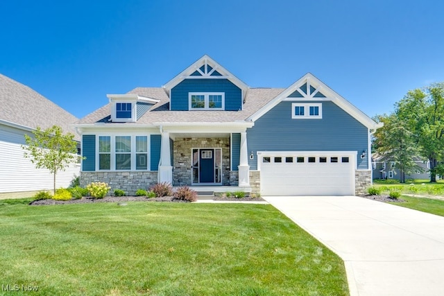 craftsman-style home with a front lawn and a garage