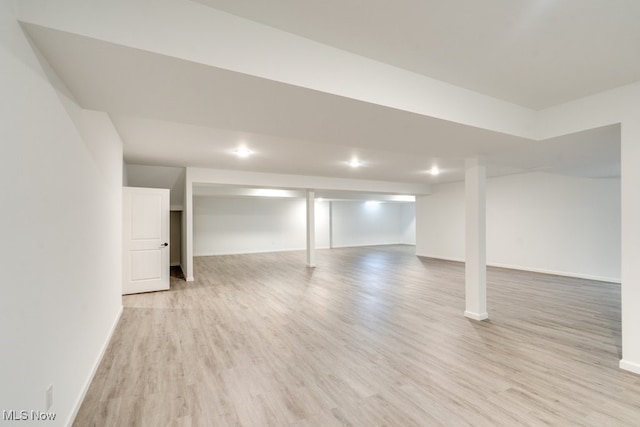 basement featuring light hardwood / wood-style flooring