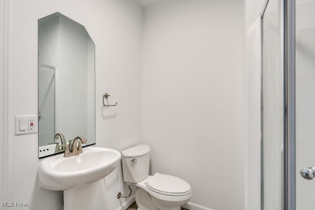 bathroom featuring sink and toilet