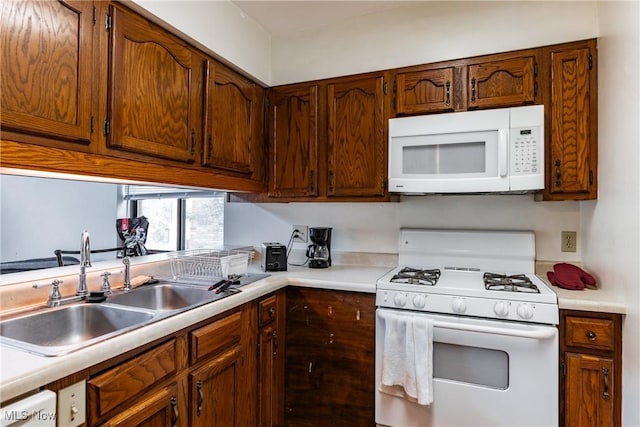 kitchen with white appliances and sink