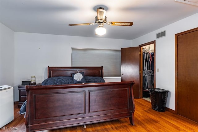 bedroom with hardwood / wood-style flooring and ceiling fan