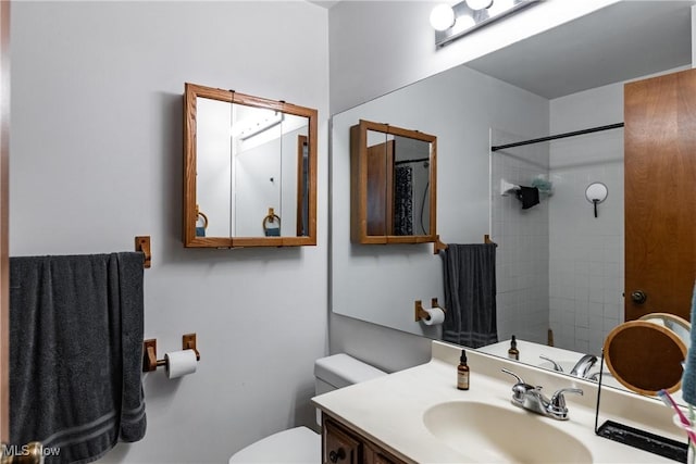 bathroom featuring toilet, a shower with curtain, and vanity