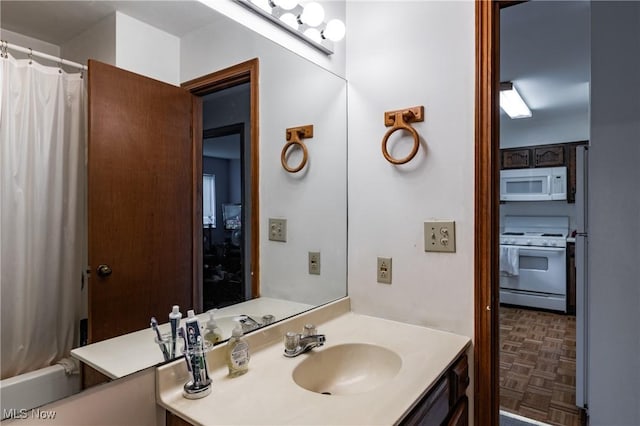 bathroom featuring vanity and parquet floors