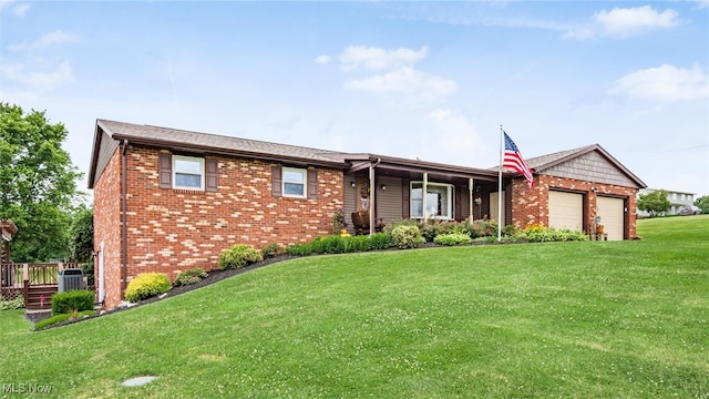 ranch-style house featuring cooling unit, a garage, and a front lawn