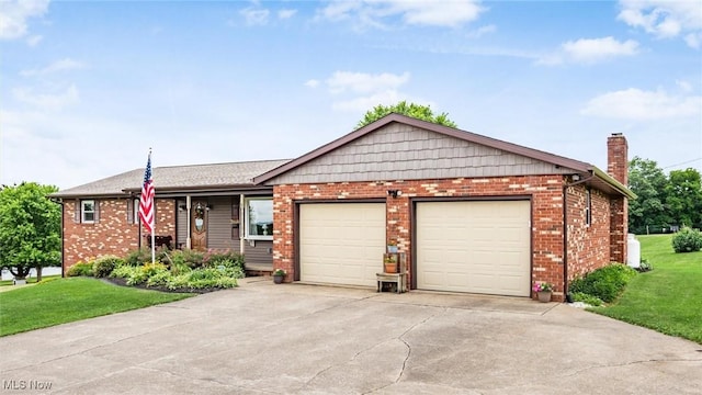 ranch-style home featuring brick siding, an attached garage, concrete driveway, and a front lawn