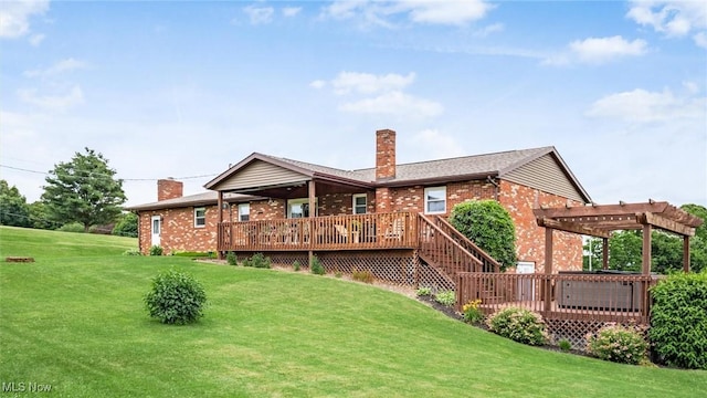 rear view of property with a wooden deck, brick siding, a pergola, and a lawn