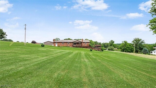 view of yard with a deck