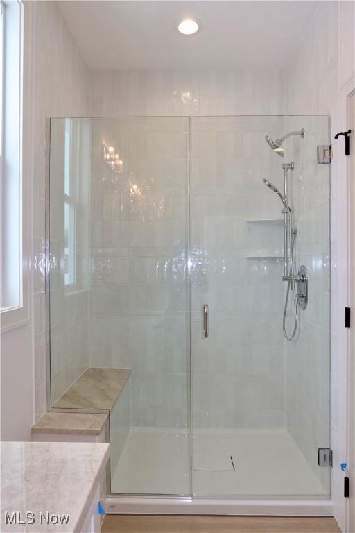 bathroom with vanity and an enclosed shower