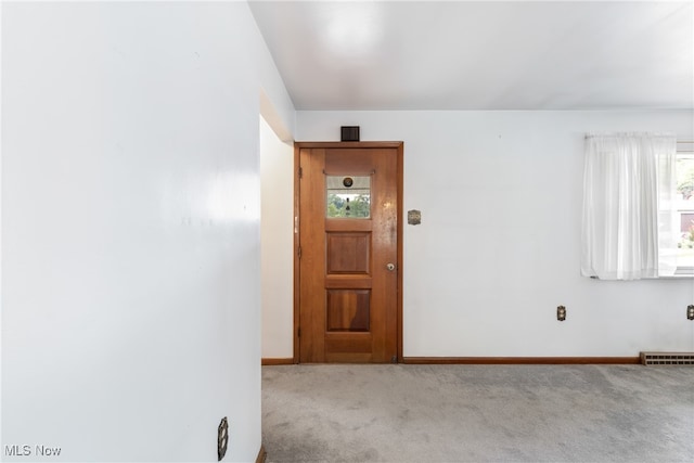 view of carpeted foyer