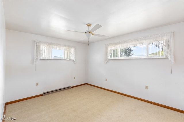 empty room with ceiling fan and carpet