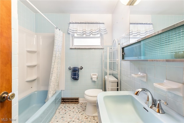 full bathroom with tile patterned flooring, tile walls, toilet, and shower / tub combo