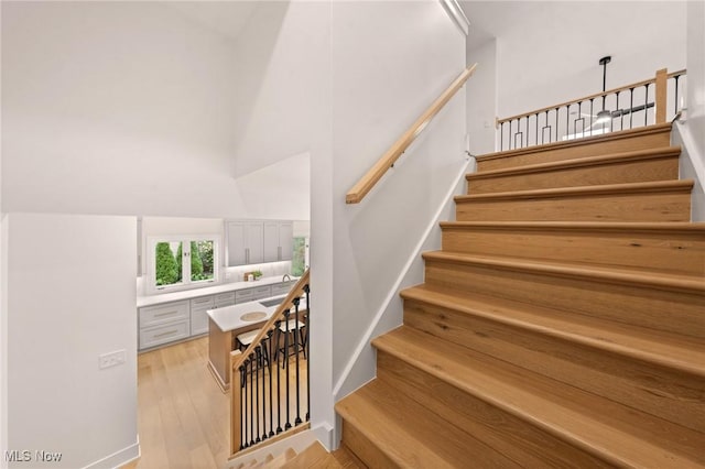 stairway with wood finished floors