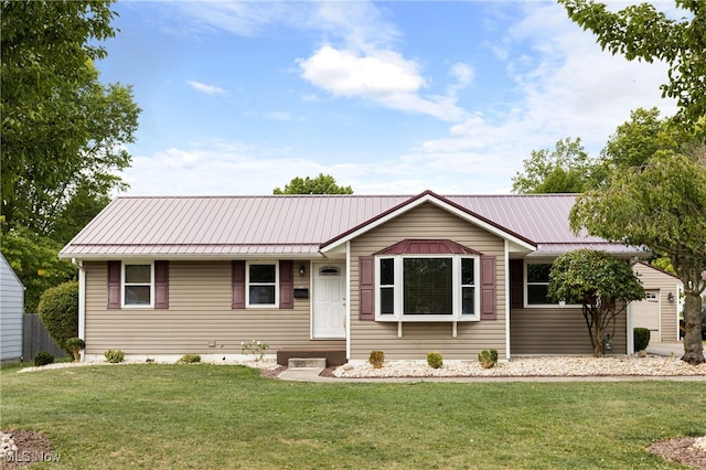 single story home featuring a front yard