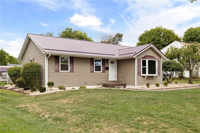 ranch-style home with a front lawn