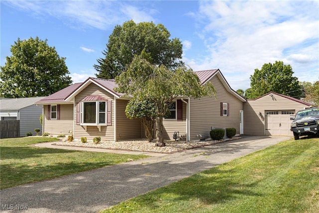 view of front of property featuring a garage and a front lawn