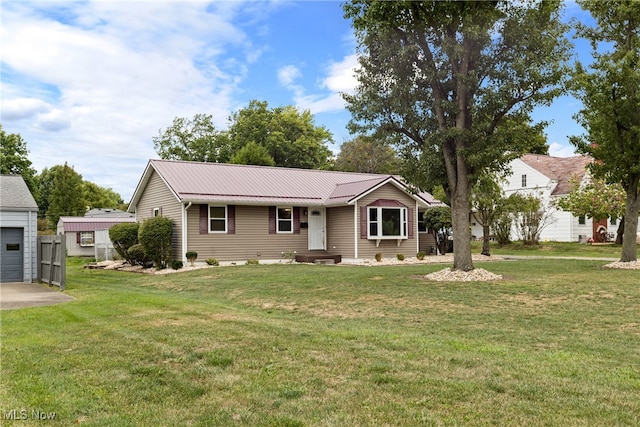 single story home with a front yard and a garage